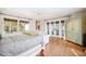 Spacious bedroom with hardwood floors and access to balcony at 367 Pelican Flight Dr, Dewees Island, SC 29451