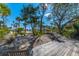 Wooden deck overlooking beach and palm trees at 367 Pelican Flight Dr, Dewees Island, SC 29451
