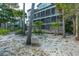 Multi-level home with screened porches, nestled amongst tropical foliage at 367 Pelican Flight Dr, Dewees Island, SC 29451