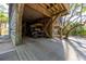 Covered parking area under the house for golf cart and storage at 367 Pelican Flight Dr, Dewees Island, SC 29451