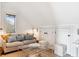 Charming guest room with a comfortable couch and glass coffee table at 367 Pelican Flight Dr, Dewees Island, SC 29451