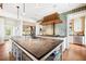 Gourmet kitchen with island, copper hood, and high-end appliances at 367 Pelican Flight Dr, Dewees Island, SC 29451