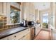 Well-equipped kitchen with ocean views and ample storage at 367 Pelican Flight Dr, Dewees Island, SC 29451