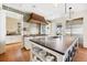 Spacious kitchen featuring a large island, stainless steel appliances, and custom cabinetry at 367 Pelican Flight Dr, Dewees Island, SC 29451