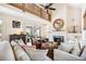 Spacious living area with hardwood floors and a fireplace at 367 Pelican Flight Dr, Dewees Island, SC 29451