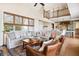 Open living space with hardwood floors, high ceilings, and views of kitchen at 367 Pelican Flight Dr, Dewees Island, SC 29451