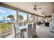 Deck with ocean views, dining table, and comfortable seating at 367 Pelican Flight Dr, Dewees Island, SC 29451