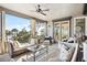 Spacious ocean view porch featuring comfortable seating and ceiling fans at 367 Pelican Flight Dr, Dewees Island, SC 29451