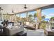 Relaxing oceanfront porch with wicker furniture and stunning ocean views at 367 Pelican Flight Dr, Dewees Island, SC 29451