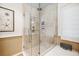 Large walk-in shower with glass enclosure and neutral tile at 367 Pelican Flight Dr, Dewees Island, SC 29451