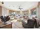 Cozy sitting room with hardwood floors, comfortable seating, and ocean views at 367 Pelican Flight Dr, Dewees Island, SC 29451