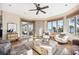 Sunlit sitting room with hardwood floors, comfortable seating and ocean views at 367 Pelican Flight Dr, Dewees Island, SC 29451