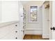 Bright walk-in closet with built-in shelves and drawers at 367 Pelican Flight Dr, Dewees Island, SC 29451