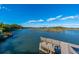 Serene waterfront view with a dock and bench, offering a tranquil setting at 367 Pelican Flight Dr, Dewees Island, SC 29451