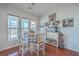 Charming breakfast nook with a round table and chairs, hardwood floors, and a view of the backyard at 369 Waterlily Way, Summerville, SC 29486