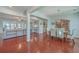 Open concept dining room with hardwood floors and view of living room at 369 Waterlily Way, Summerville, SC 29486