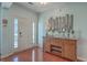 Bright entryway with hardwood floors and decorative console table at 369 Waterlily Way, Summerville, SC 29486
