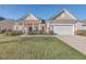 Craftsman style home with front porch and landscaped yard at 369 Waterlily Way, Summerville, SC 29486