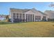 House back with screened porch and grassy yard at 369 Waterlily Way, Summerville, SC 29486