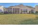 House back with screened porch and grassy yard at 369 Waterlily Way, Summerville, SC 29486