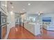 Open concept kitchen with island, stainless steel appliances, and hardwood floors at 369 Waterlily Way, Summerville, SC 29486