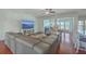 Spacious living room with hardwood floors and large TV at 369 Waterlily Way, Summerville, SC 29486