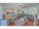 Open living room with hardwood floors and view of kitchen at 369 Waterlily Way, Summerville, SC 29486
