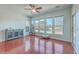 Bright sunroom with hardwood floors, multiple windows, and built-in storage at 369 Waterlily Way, Summerville, SC 29486