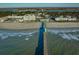 Long pier extending into ocean with shadow at 403 W West Ashley Ave, Folly Beach, SC 29439