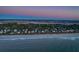 Coastal homes line the beach, offering stunning sunset views at 403 W West Ashley Ave, Folly Beach, SC 29439
