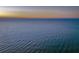 Tranquil ocean scene at sunset, captured from an aerial perspective at 403 W West Ashley Ave, Folly Beach, SC 29439