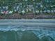 Bird's-eye view of beachfront properties and ocean waves at 403 W West Ashley Ave, Folly Beach, SC 29439