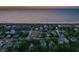 Elevated view of coastal neighborhood with beach access at sunset at 403 W West Ashley Ave, Folly Beach, SC 29439