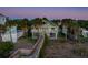Elevated beach house with boardwalk, parking, and surrounding homes at 403 W West Ashley Ave, Folly Beach, SC 29439