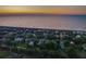 Beachfront homes and dune landscape at sunset, seen from above at 403 W West Ashley Ave, Folly Beach, SC 29439