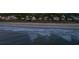 Beachfront homes and tranquil ocean waves at sunset at 403 W West Ashley Ave, Folly Beach, SC 29439