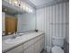 Bathroom with updated vanity and striped wallpaper at 403 W West Ashley Ave, Folly Beach, SC 29439