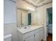 Small bathroom with white vanity and shower/tub combo at 403 W West Ashley Ave, Folly Beach, SC 29439