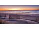 Sand dunes with wooden fences overlooking the ocean at 403 W West Ashley Ave, Folly Beach, SC 29439
