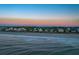 Coastal houses and beach at sunset at 403 W West Ashley Ave, Folly Beach, SC 29439