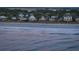 Beachfront homes and ocean waves at sunset at 403 W West Ashley Ave, Folly Beach, SC 29439