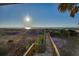 Elevated boardwalk path to beach at sunrise at 403 W West Ashley Ave, Folly Beach, SC 29439