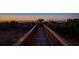 Wooden walkway leading to the beach at sunrise at 403 W West Ashley Ave, Folly Beach, SC 29439