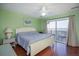King-size bed in light green bedroom with ocean view at 403 W West Ashley Ave, Folly Beach, SC 29439