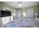 King-size bed in light green bedroom, access to closets at 403 W West Ashley Ave, Folly Beach, SC 29439