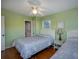 Bedroom with two twin beds, one with access to a full bathroom at 403 W West Ashley Ave, Folly Beach, SC 29439
