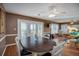 Open concept dining room with hardwood floors, a table for six, and views into the living room at 403 W West Ashley Ave, Folly Beach, SC 29439