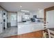 Well-equipped kitchen with white cabinets, stainless steel appliances, and a breakfast bar at 403 W West Ashley Ave, Folly Beach, SC 29439