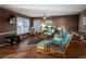 Relaxing living room with wicker furniture and hardwood floors at 403 W West Ashley Ave, Folly Beach, SC 29439