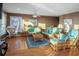 Relaxing living room with wicker furniture and hardwood floors at 403 W West Ashley Ave, Folly Beach, SC 29439